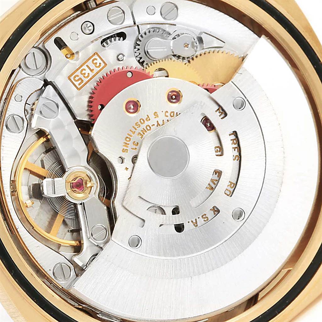 This is an angled close-up of the Rolex President 16238 Men
s Yellow Gold Brown Dial 16238 Men
s Yellow Gold Brown Dial model
s movement and internal gears, showcasing intricate mechanical components.