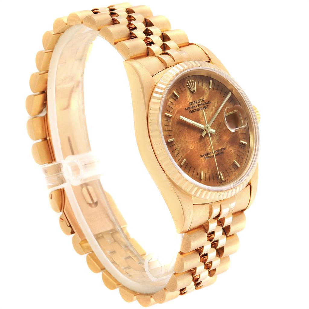 The image shows a side angle of a Rolex President 16238 Men
s Yellow Gold Brown Dial 16238 Men
s Yellow Gold Brown Dial model watch showcasing the face, bezel, and bracelet.