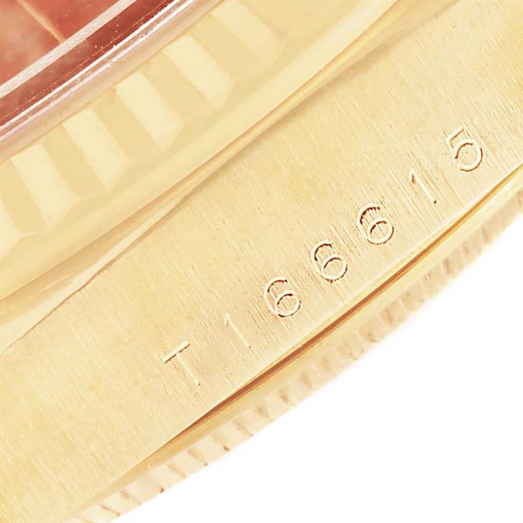 This image shows a close-up of the serial number on the side of a Rolex President 16238 Men
s Yellow Gold Brown Dial 16238 Men
s Yellow Gold Brown Dial model watch case.