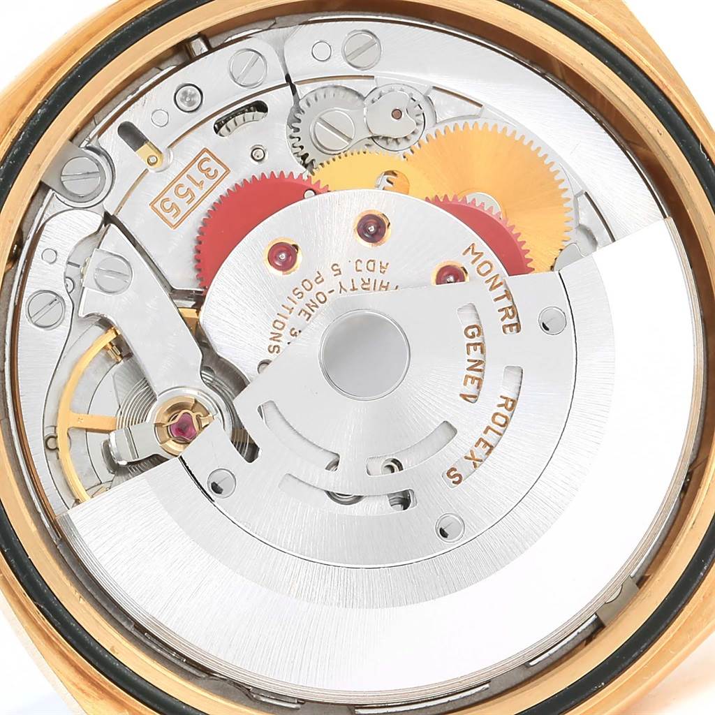 This image shows the internal mechanical movement of a Rolex President 18238 Men's Yellow Gold Blue Dial 18238 Men's Yellow Gold Blue Dial model watch, including gears and the rotor.
