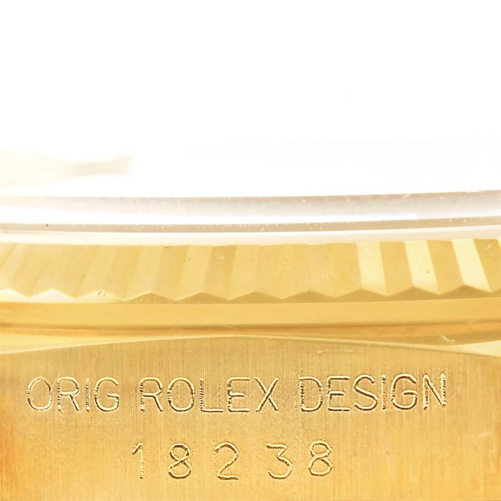 This image shows a close-up of the model number and engraving on the gold case side of a Rolex President 18238 Men's Yellow Gold Blue Dial 18238 Men's Yellow Gold Blue Dial 18238 watch.