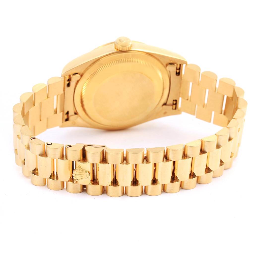 This image shows the back view of a Rolex President 18238 Men's Yellow Gold Blue Dial 18238 Men's Yellow Gold Blue Dial model watch, highlighting its gold case and bracelet.