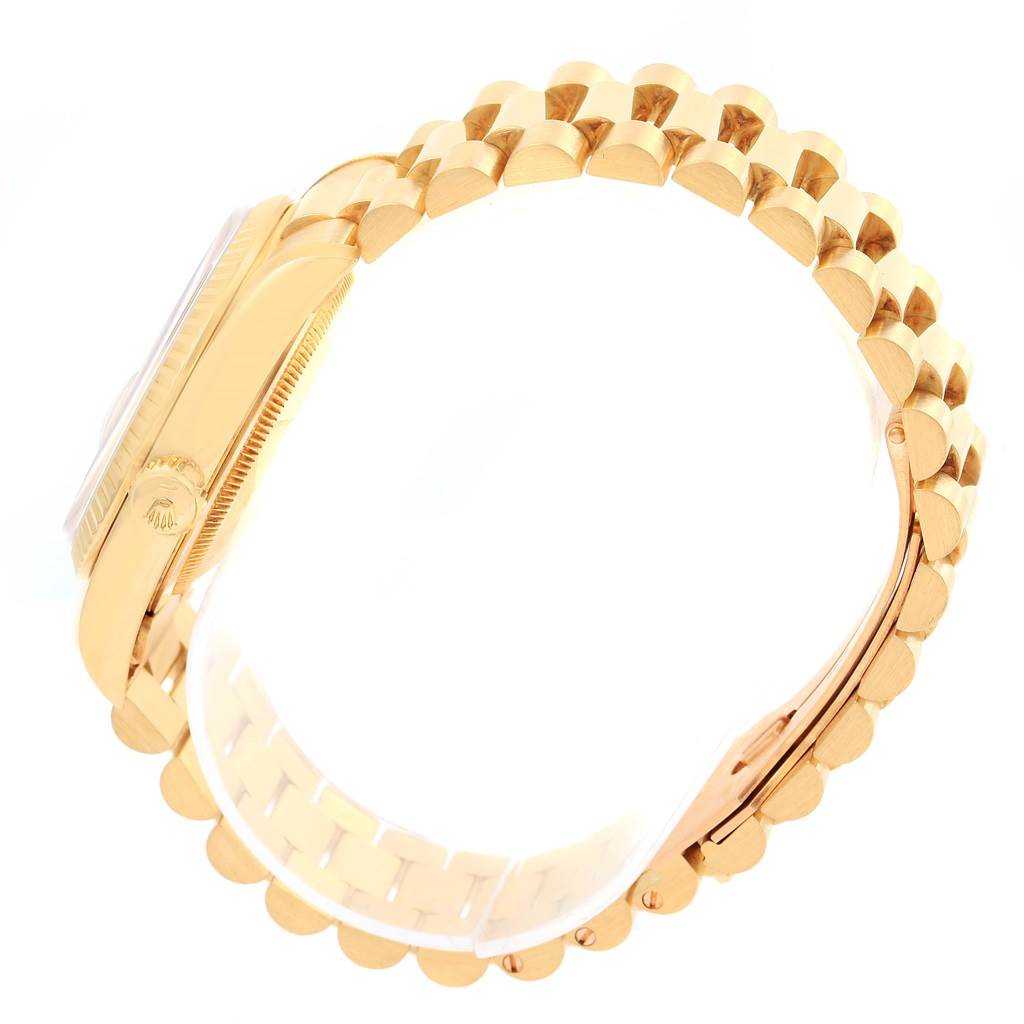 This image shows a side angle of a Rolex President 18238 Men's Yellow Gold Blue Dial 18238 Men's Yellow Gold Blue Dial model watch, highlighting its gold band and crown.