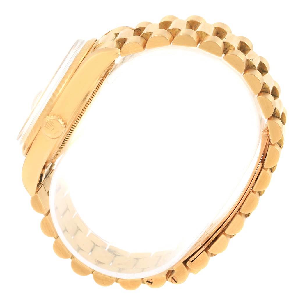 This image shows a side view of a gold Rolex President 1803 Men's Yellow Gold White Dial 1803 Men's Yellow Gold White Dial model watch, including the bezel, crown, case, and part of the bracelet.