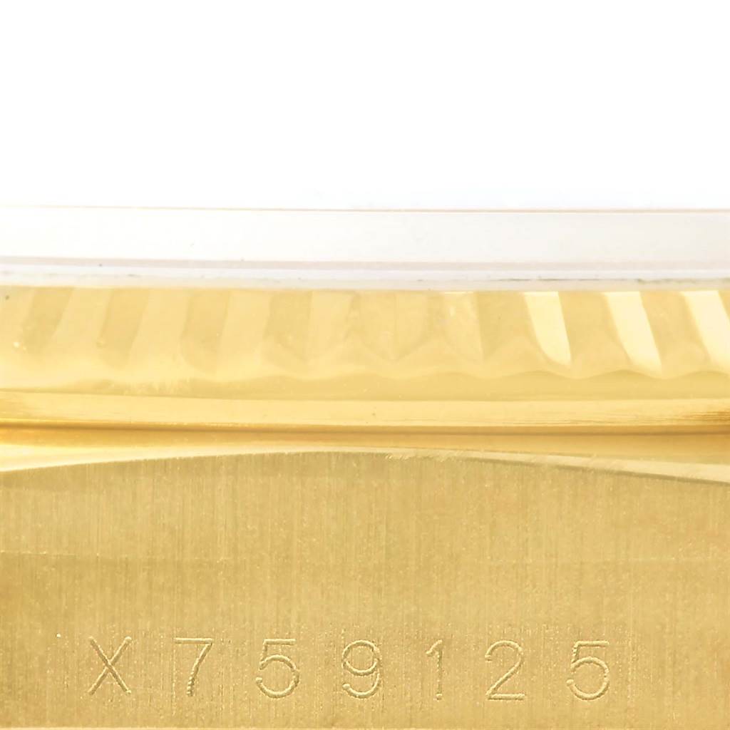 The image shows a close-up of the edge and serial number of a Rolex President 18238 Men's Yellow Gold White Dial 18238 Men's Yellow Gold White Dial model watch.