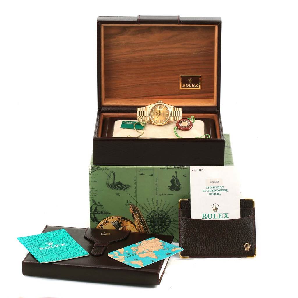 The image shows a Rolex President 18238 Men's Yellow Gold Champagne Dial 18238 Men's Yellow Gold Champagne Dial model watch and its accessories, including the box, booklets, and authentication papers.