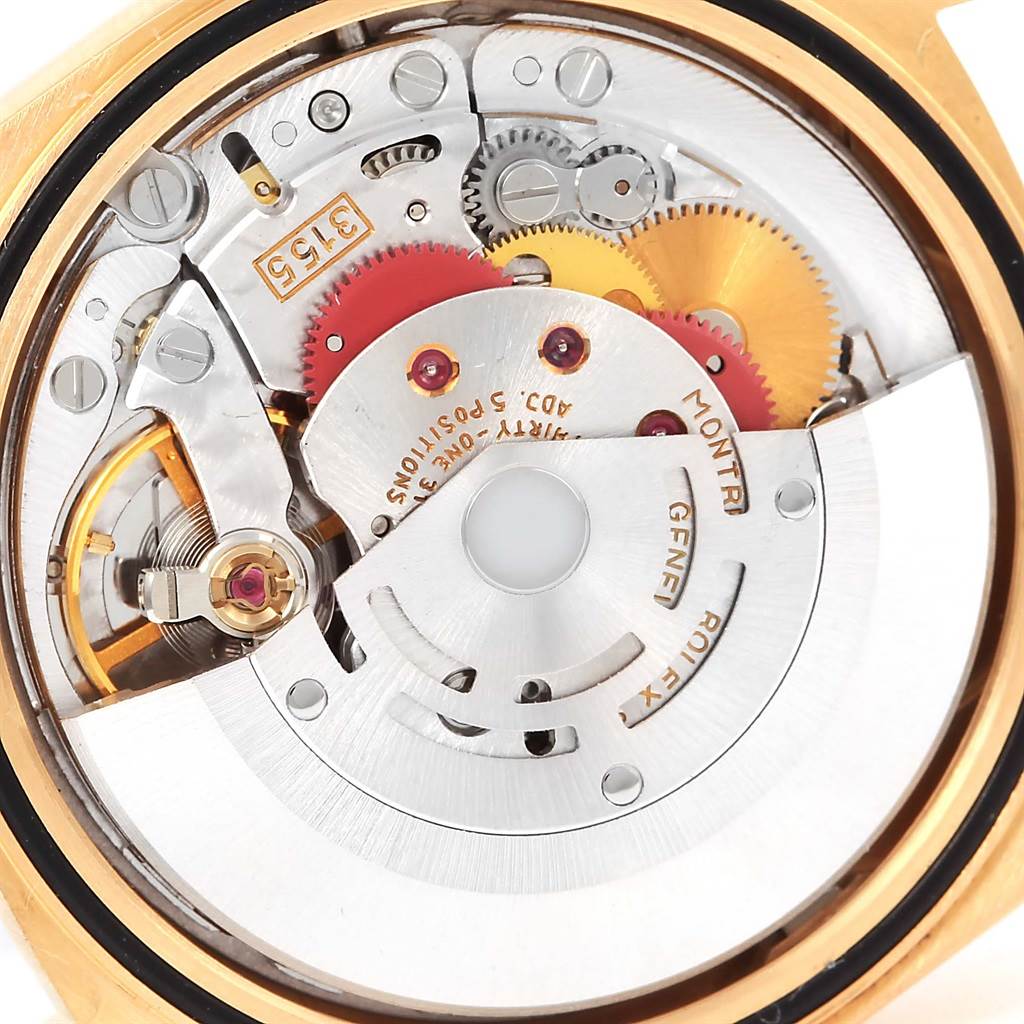 This is a close-up view of the internal mechanism of a Rolex President 18238 Men's Yellow Gold Champagne Dial 18238 Men's Yellow Gold Champagne Dial model watch, showcasing gears and intricate components.