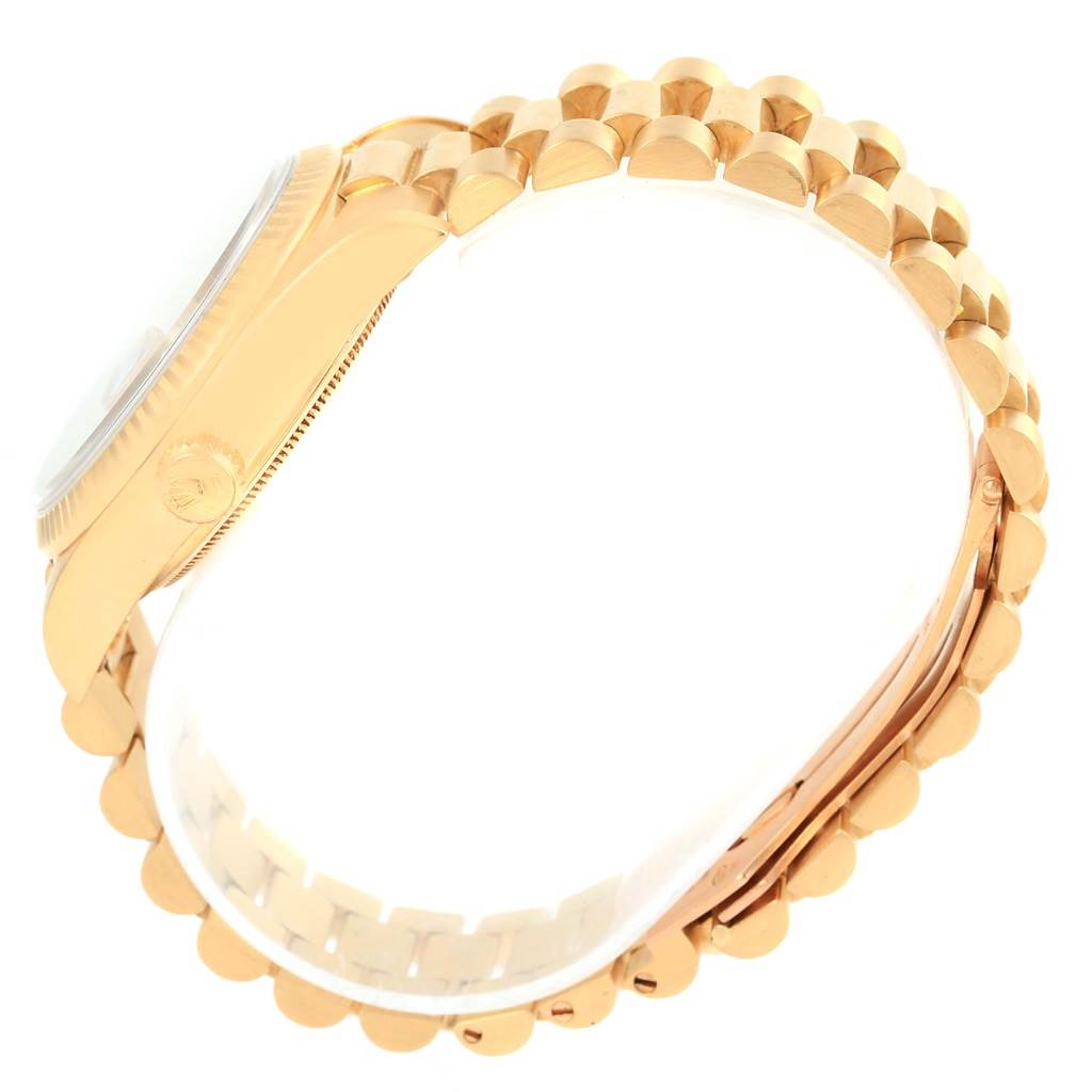 The image shows a side view of a Rolex President 18038 Men's Yellow Gold Champagne Dial 18038 Men's Yellow Gold Champagne Dial model watch, focusing on part of the case and the gold bracelet.