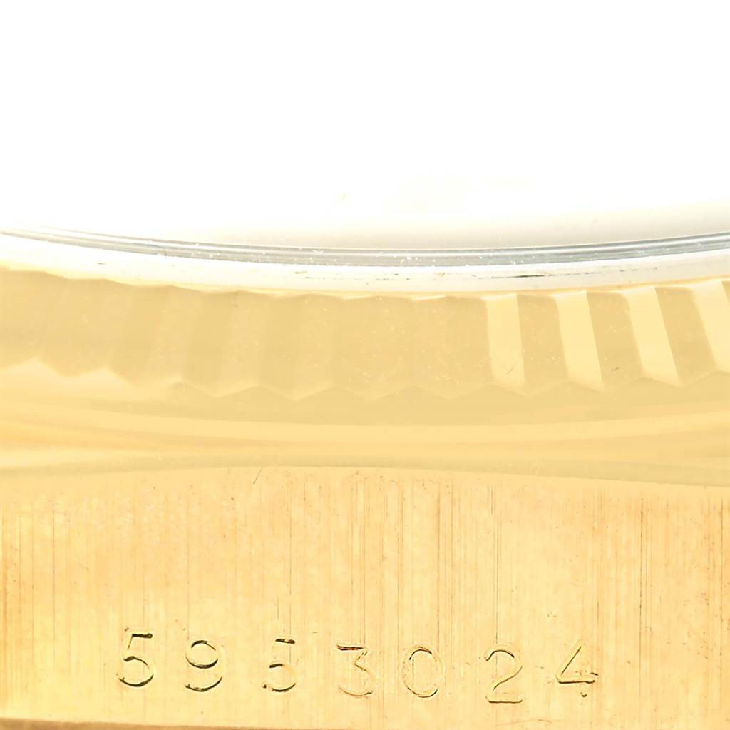 This image shows a close-up of the case and fluted bezel with a partial serial number of the Rolex President 18038 Men's Yellow Gold Champagne Dial 18038 Men's Yellow Gold Champagne Dial model.