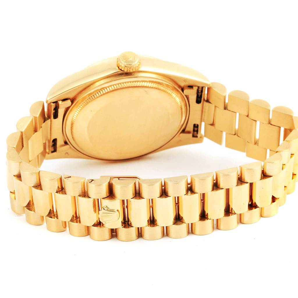 This image shows the back view of a Rolex President 18038 Men's Yellow Gold Champagne Dial 18038 Men's Yellow Gold Champagne Dial model watch, highlighting its gold bracelet and case back.