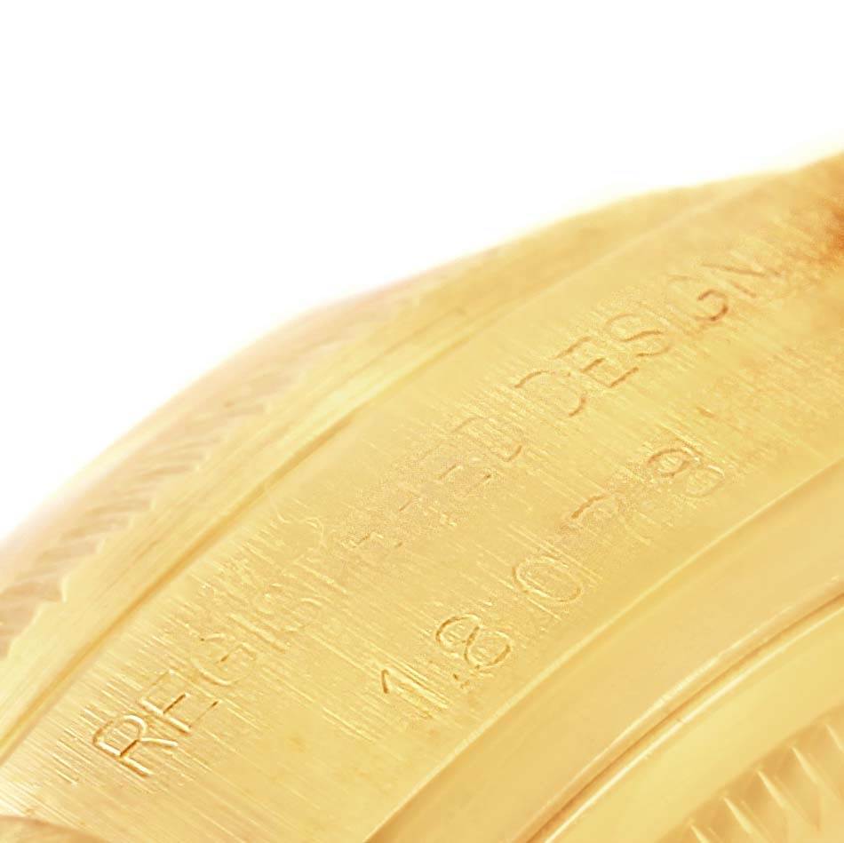 The image shows a close-up angle of the engraved inner side of the bezel of a Rolex President 18078 Men's Yellow Gold Blue Dial 18078 Men's Yellow Gold Blue Dial model.