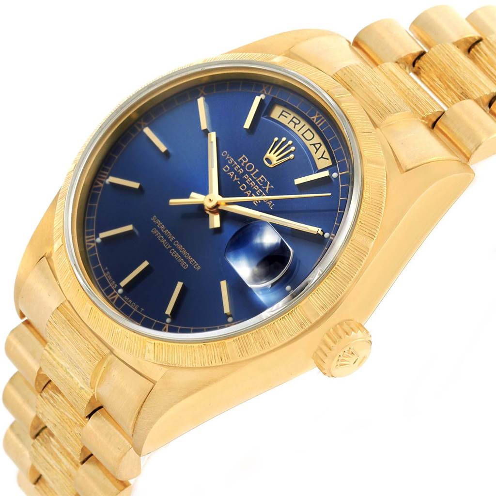 The image shows a Rolex President 18078 Men's Yellow Gold Blue Dial 18078 Men's Yellow Gold Blue Dial model watch at an angled view, highlighting the bracelet, blue dial, and crown.