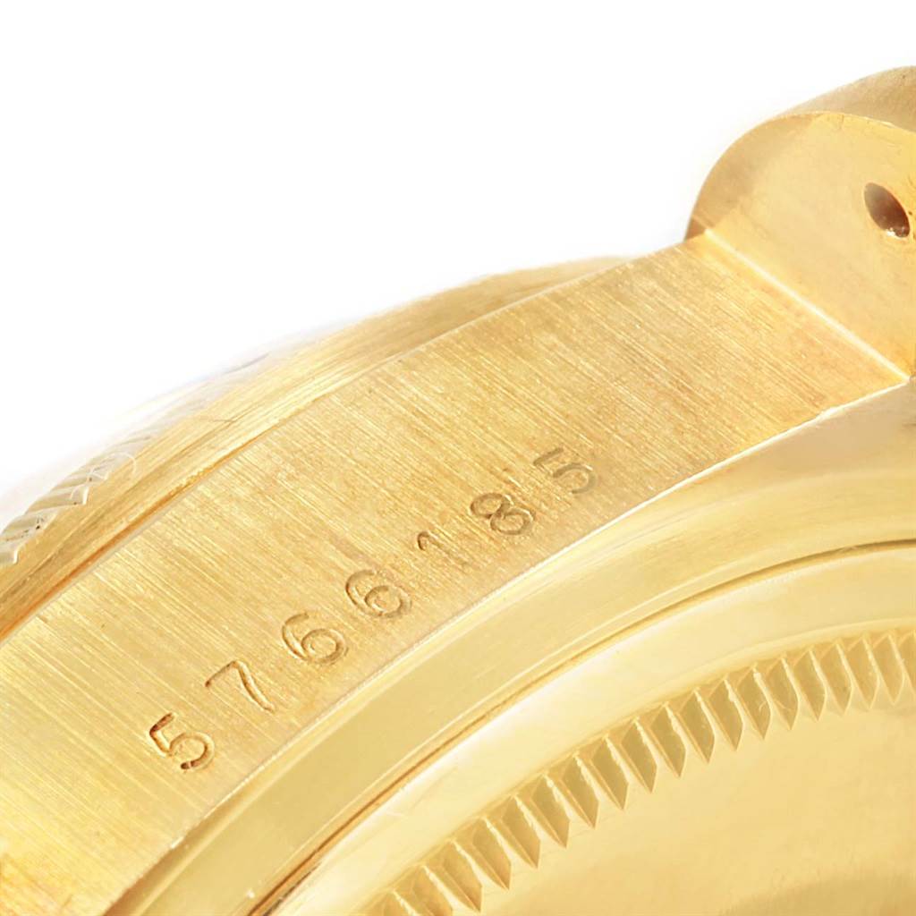 This image shows a close-up of the band and part of the case back of a Rolex President 18078 Men's Yellow Gold Blue Dial 18078 Men's Yellow Gold Blue Dial model watch, displaying the serial number.