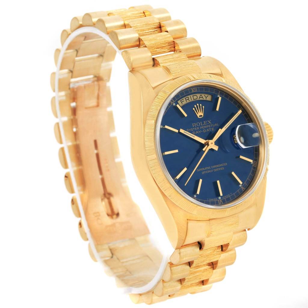 The image shows a side angle of the Rolex President 18078 Men's Yellow Gold Blue Dial 18078 Men's Yellow Gold Blue Dial model watch, displaying its gold bracelet and blue dial.