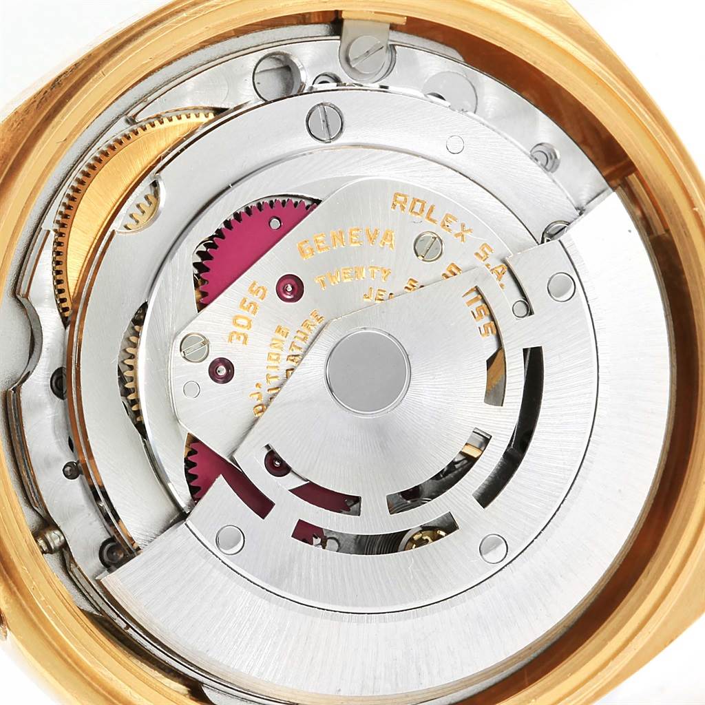 The image shows the internal mechanical movement of a Rolex President 18078 Men's Yellow Gold Blue Dial 18078 Men's Yellow Gold Blue Dial model watch, focusing on its intricate gears and components.