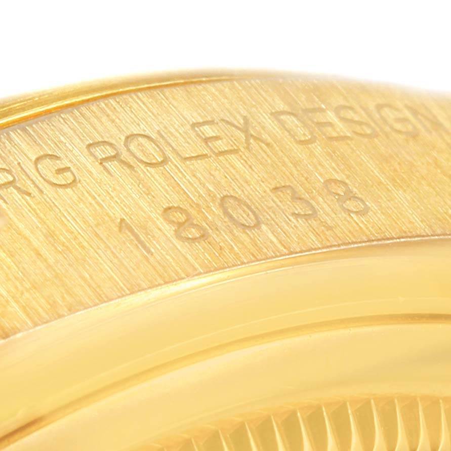 This is a close-up angle of the Rolex President 18038 Men
s Yellow Gold Beige Dial 18038 Men
s Yellow Gold Beige Dial model watch, showing the engraved model number 18038.