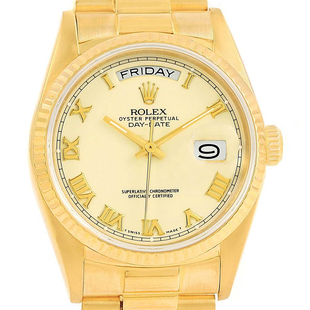 The image shows a front view of a Rolex President 18038 Men
s Yellow Gold Beige Dial 18038 Men
s Yellow Gold Beige Dial model watch, displaying the dial, day, date, and part of the bracelet.