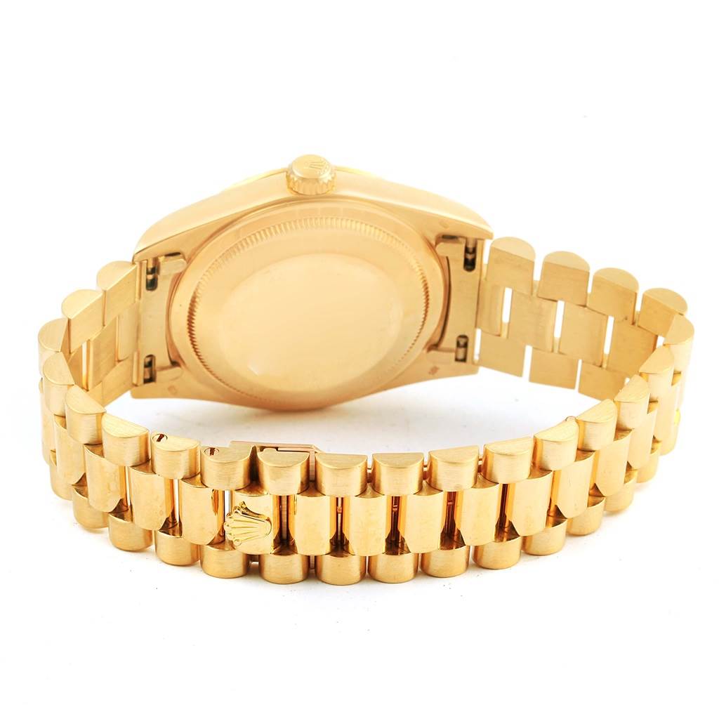 The image shows the back and bracelet of a gold Rolex President 18238 Men's Yellow Gold Champagne Dial 18238 Men's Yellow Gold Champagne Dial model watch, highlighting the clasp and case back.