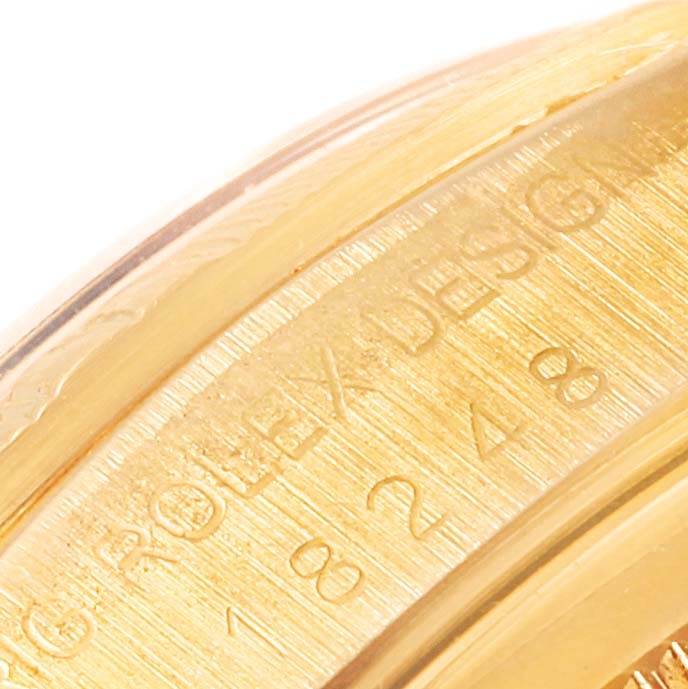 This image shows a close-up of the gold case edge and engraving on the Rolex President 18248 Men's Yellow Gold Champagne Dial 18248 Men's Yellow Gold Champagne Dial model watch.