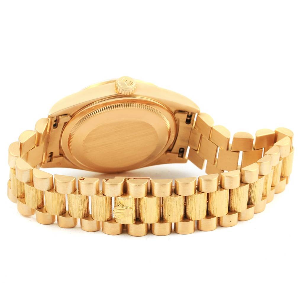 The image shows the backside of a Rolex President 18248 Men's Yellow Gold Champagne Dial 18248 Men's Yellow Gold Champagne Dial model watch, focusing on the case back and bracelet.