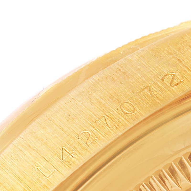 The image shows a close-up angle of the case back and serial number engraving on a Rolex President 18248 Men's Yellow Gold Champagne Dial 18248 Men's Yellow Gold Champagne Dial model watch.