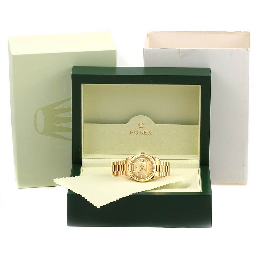 The image shows a Rolex President 118238 Men's Yellow Gold Champagne Dial 118238 Men's Yellow Gold Champagne Dial model watch inside an open green box with a cleaning cloth, along with the outer packaging.