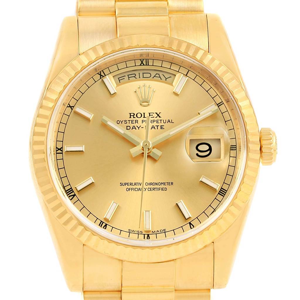 This image shows a front view of the Rolex Day-Date President model, displaying its gold dial, fluted bezel, and bracelet.
