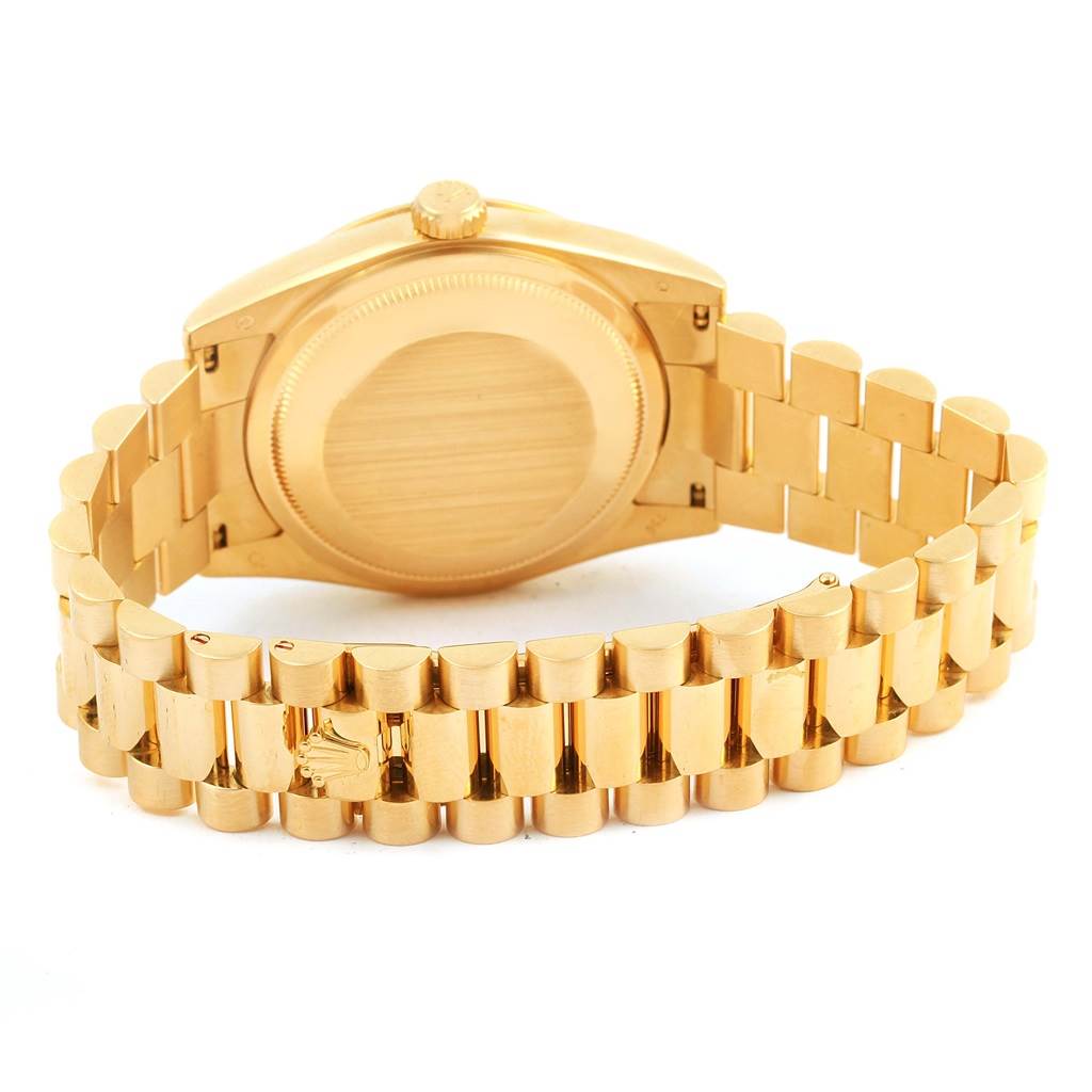 This image shows the back and bracelet of a Rolex President 118238 Men's Yellow Gold Champagne Dial 118238 Men's Yellow Gold Champagne Dial model watch.