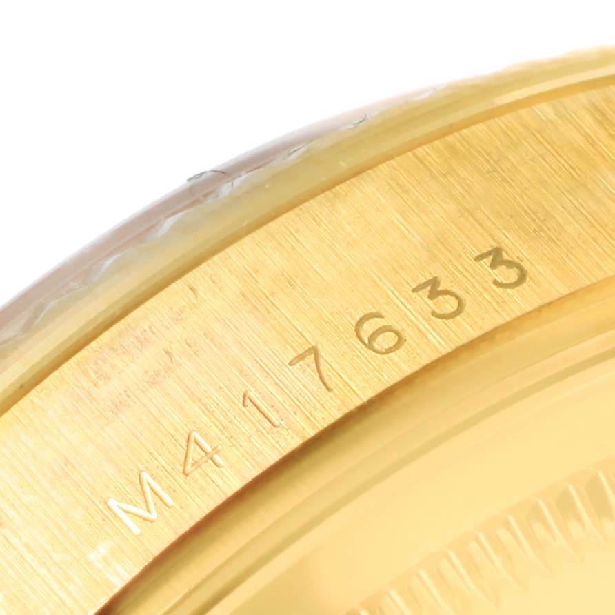 This image shows a close-up of the serial number engraving on the gold rim of a Rolex President 118238 Men's Yellow Gold Champagne Dial 118238 Men's Yellow Gold Champagne Dial model watch.