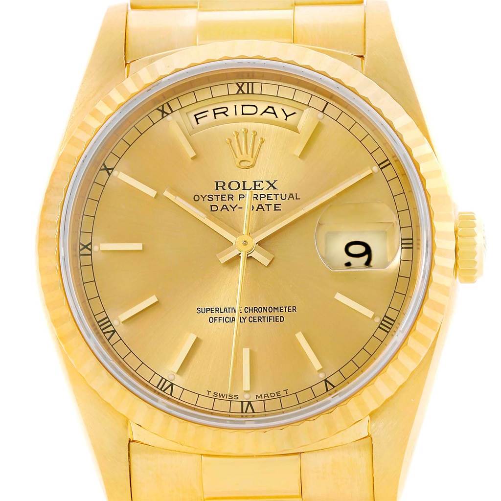 This image shows a close-up view of the Rolex President 18238 Men's Yellow Gold Champagne Dial 18238 Men's Yellow Gold Champagne Dial Oyster Perpetual Day-Date watch, highlighting the dial, day-date feature, and fluted bezel.