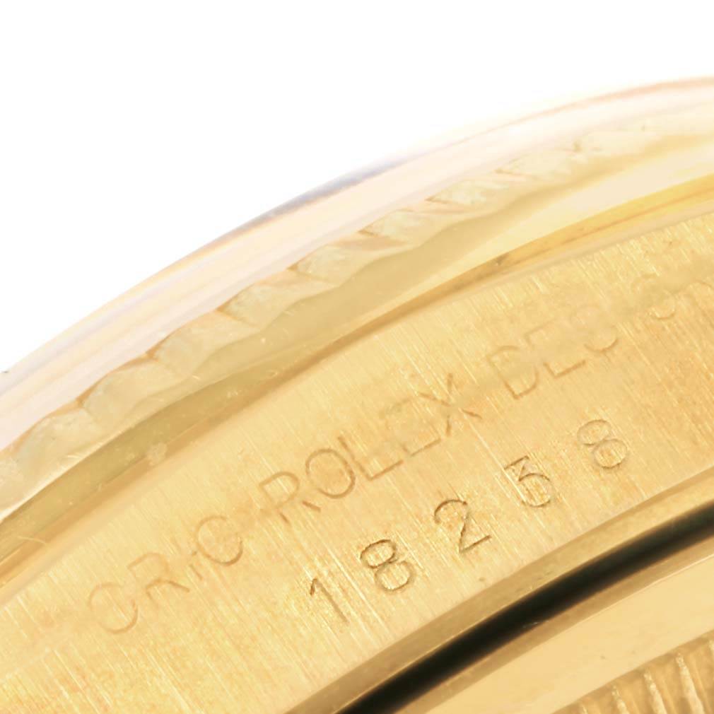 This image shows a close-up of the gold casing and engraved details of a Rolex President 18238 Men's Yellow Gold Champagne Dial 18238 Men's Yellow Gold Champagne Dial model watch.