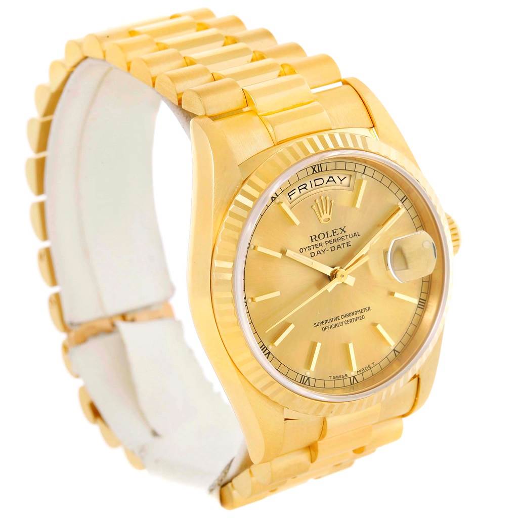 The image shows a Rolex President 18238 Men's Yellow Gold Champagne Dial 18238 Men's Yellow Gold Champagne Dial model watch from an oblique angle, displaying its face, day and date window, bracelet, and crown.