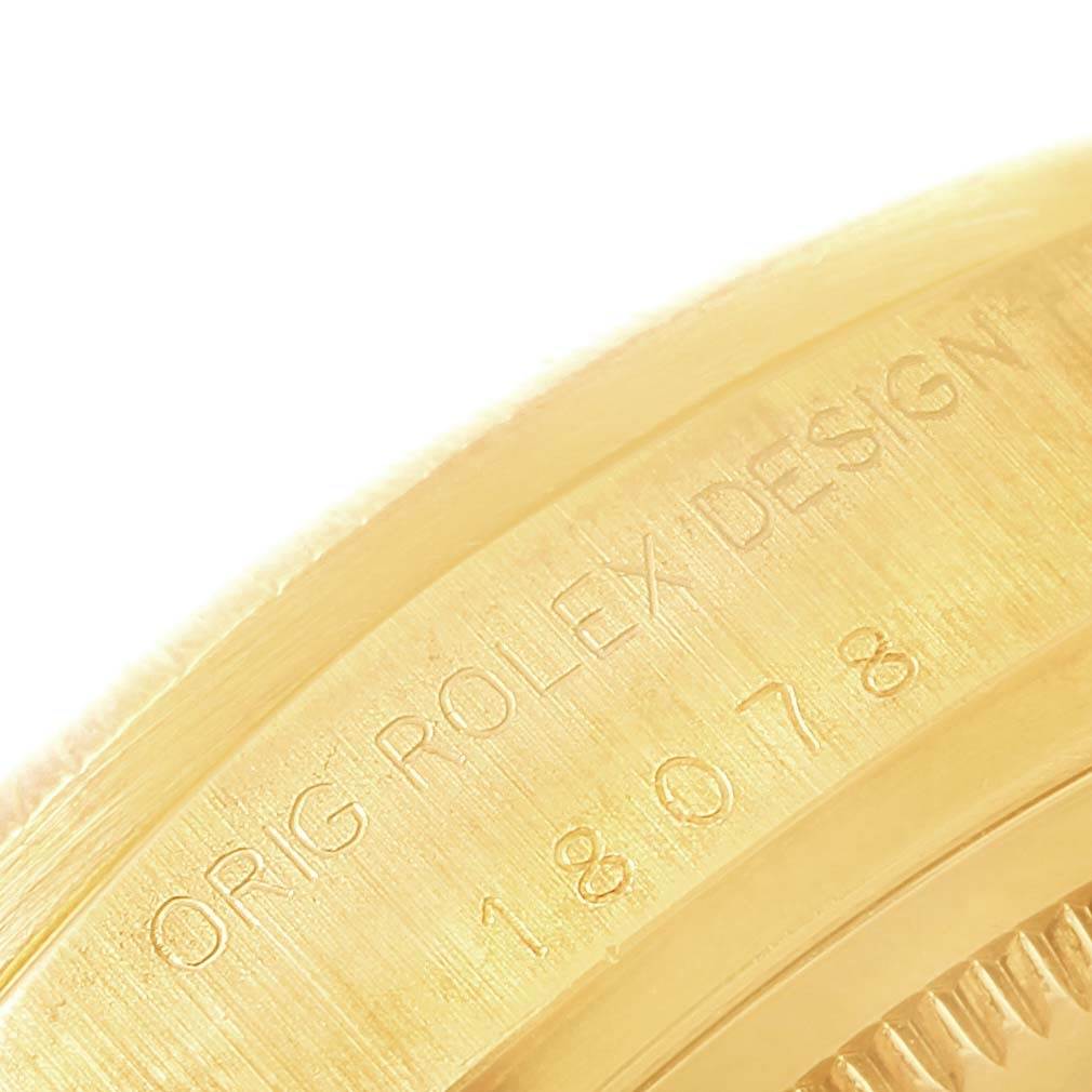 This image shows a close-up of the engraved text on the side of a Rolex President 18078 Men's Yellow Gold Black Dial 18078 Men's Yellow Gold Black Dial watch case.