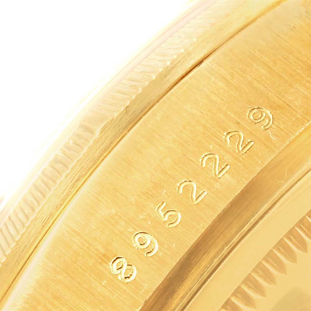 This image shows a close-up of the case edge with part numbers of a Rolex President 18078 Men's Yellow Gold Silver Dial 18078 Men's Yellow Gold Silver Dial model.