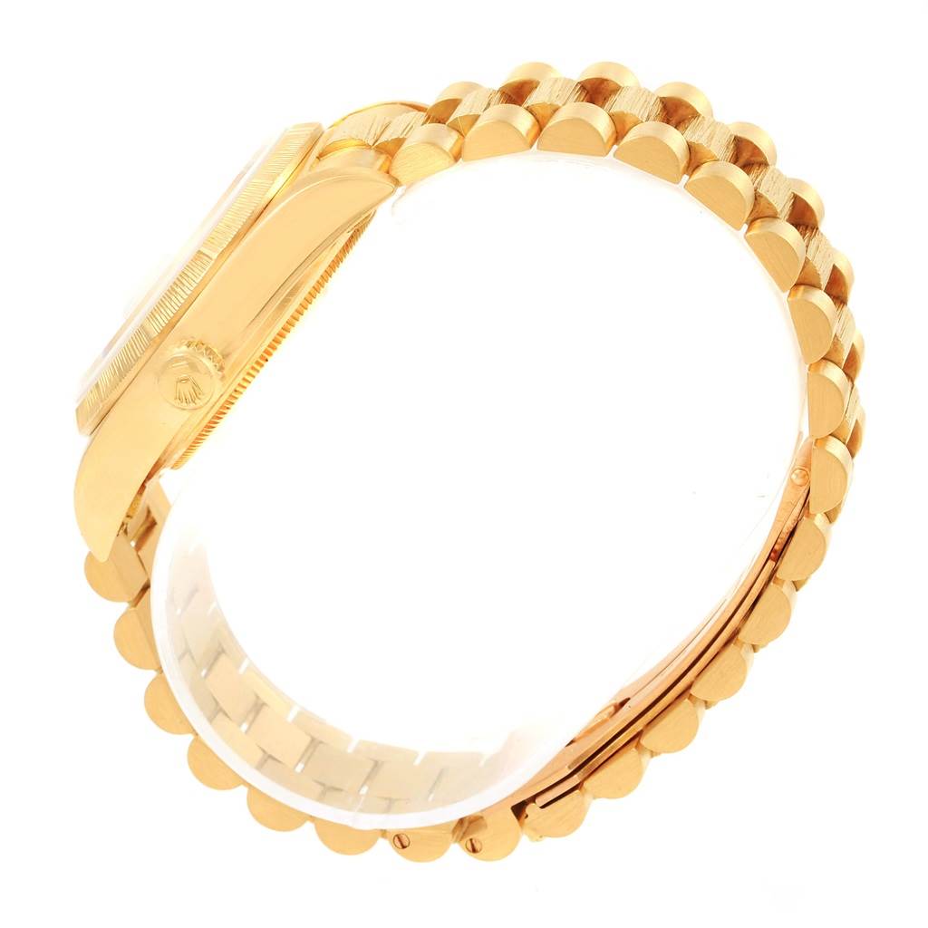 This image shows the side view and bracelet of a Rolex President 18078 Men's Yellow Gold Silver Dial 18078 Men's Yellow Gold Silver Dial model watch, highlighting its gold finish and clasp mechanism.