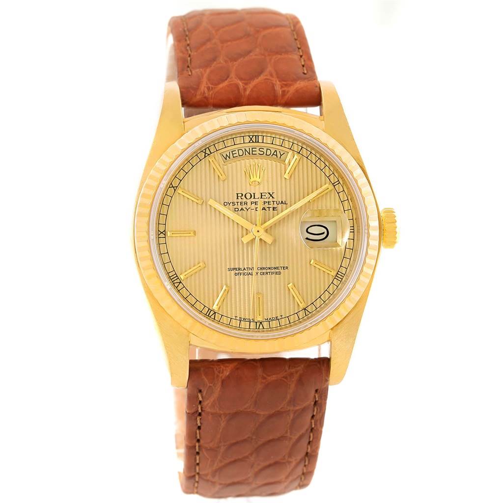 This image shows a frontal view of a Rolex President 18038 Men
s Yellow Gold Champagne Dial 18038 Men
s Yellow Gold Champagne Dial model watch with a gold case and brown leather strap.