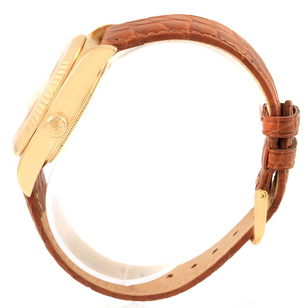 This image shows a side view of a Rolex President 18038 Men
s Yellow Gold Champagne Dial 18038 Men
s Yellow Gold Champagne Dial model watch, highlighting its case and brown leather strap.