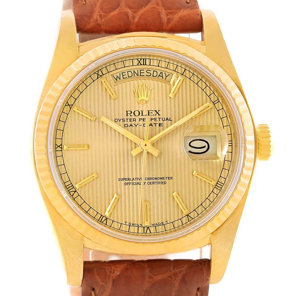 The image shows a front view of the Rolex President 18038 Men
s Yellow Gold Champagne Dial 18038 Men
s Yellow Gold Champagne Dial Day-Date watch, highlighting its gold case, dial, and leather strap.