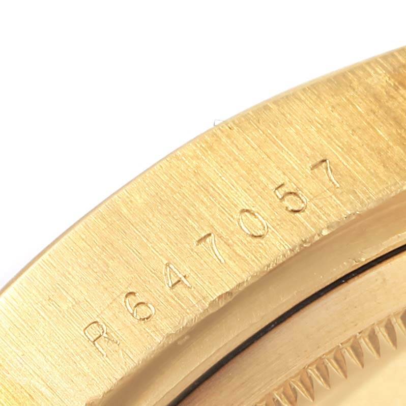 This close-up angle shows the serial number engraved on the case of the Rolex President 18038 Men
s Yellow Gold Champagne Dial 18038 Men
s Yellow Gold Champagne Dial model watch.