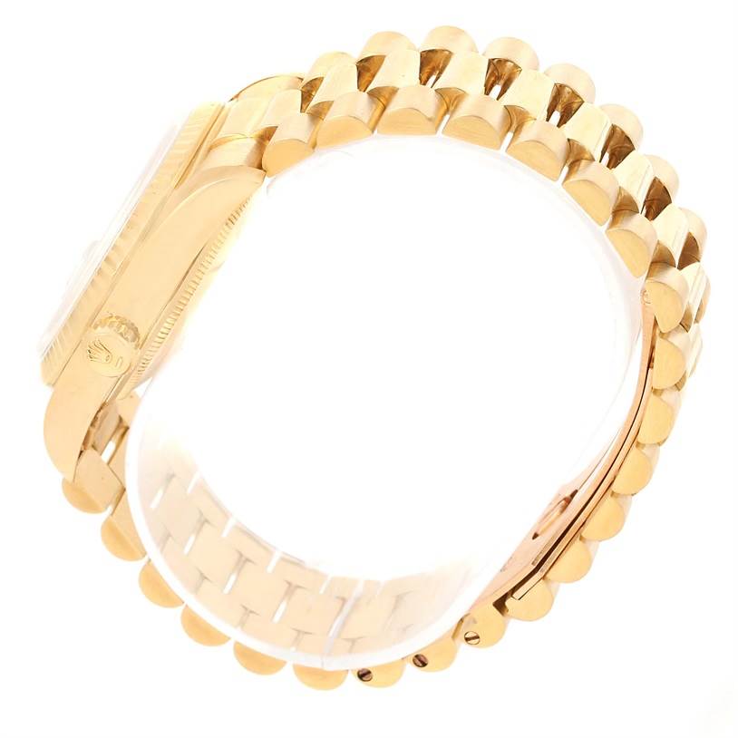 This image shows the side view of a Rolex President 18238 Men's Yellow Gold Champagne Dial 18238 Men's Yellow Gold Champagne Dial model watch, focusing on the gold bracelet and case.