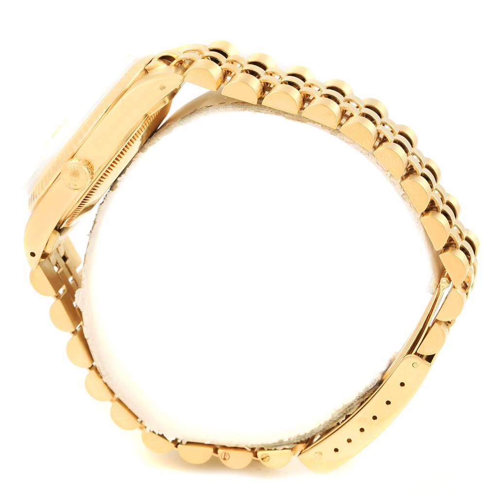 The image shows a side view of a Rolex President 15007 Men's Yellow Gold Champagne Dial 15007 Men's Yellow Gold Champagne Dial model watch, highlighting its gold bracelet and watch case.