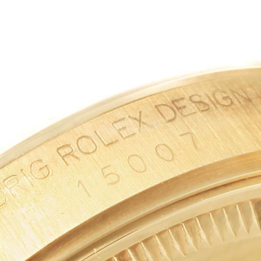 The image shows a close-up of the case side of a Rolex President 15007 Men's Yellow Gold Champagne Dial 15007 Men's Yellow Gold Champagne Dial model, highlighting the engraved model number and design text.