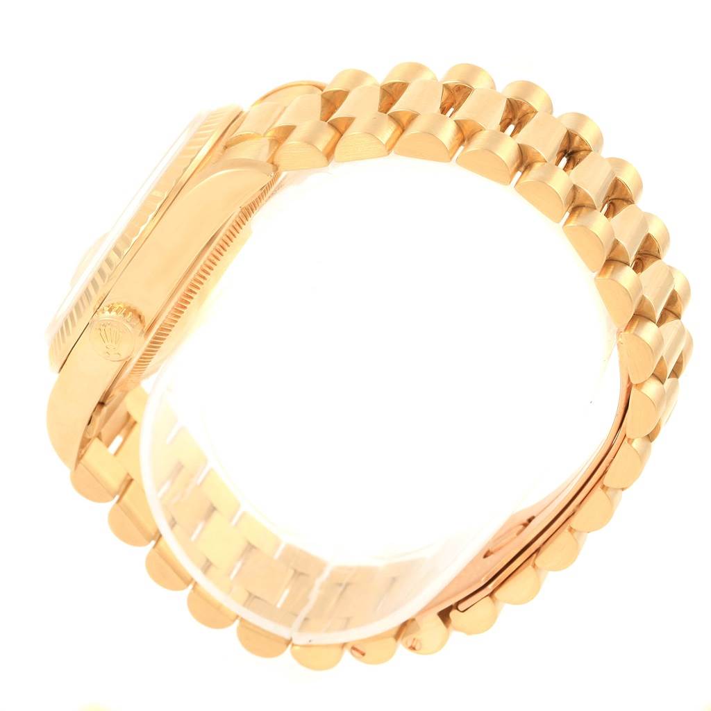 This image shows a side angle of the Rolex President 18238 Men's Yellow Gold Champagne Dial 18238 Men's Yellow Gold Champagne Dial model watch, highlighting its gold band and crown.