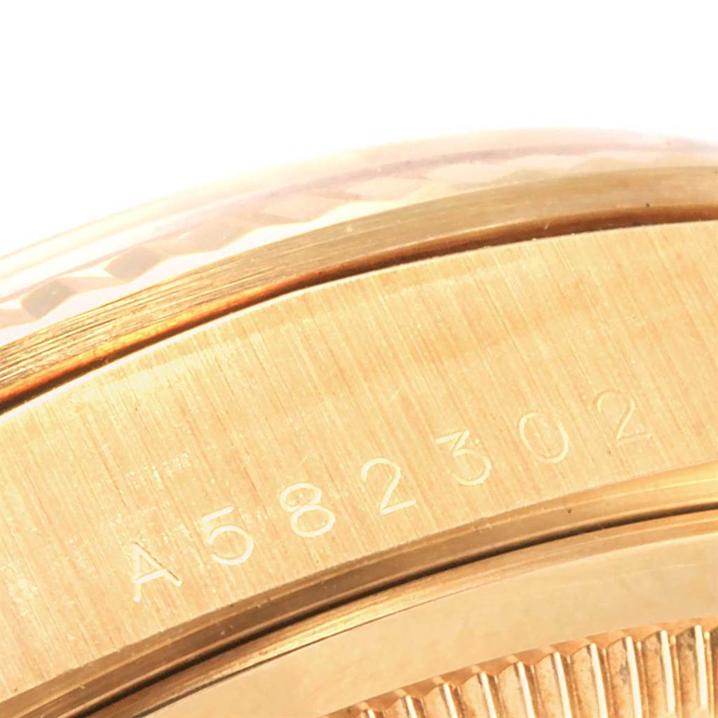 This close-up image shows the case side with the serial number of a Rolex President 18238 Men's Yellow Gold Champagne Dial 18238 Men's Yellow Gold Champagne Dial model watch.