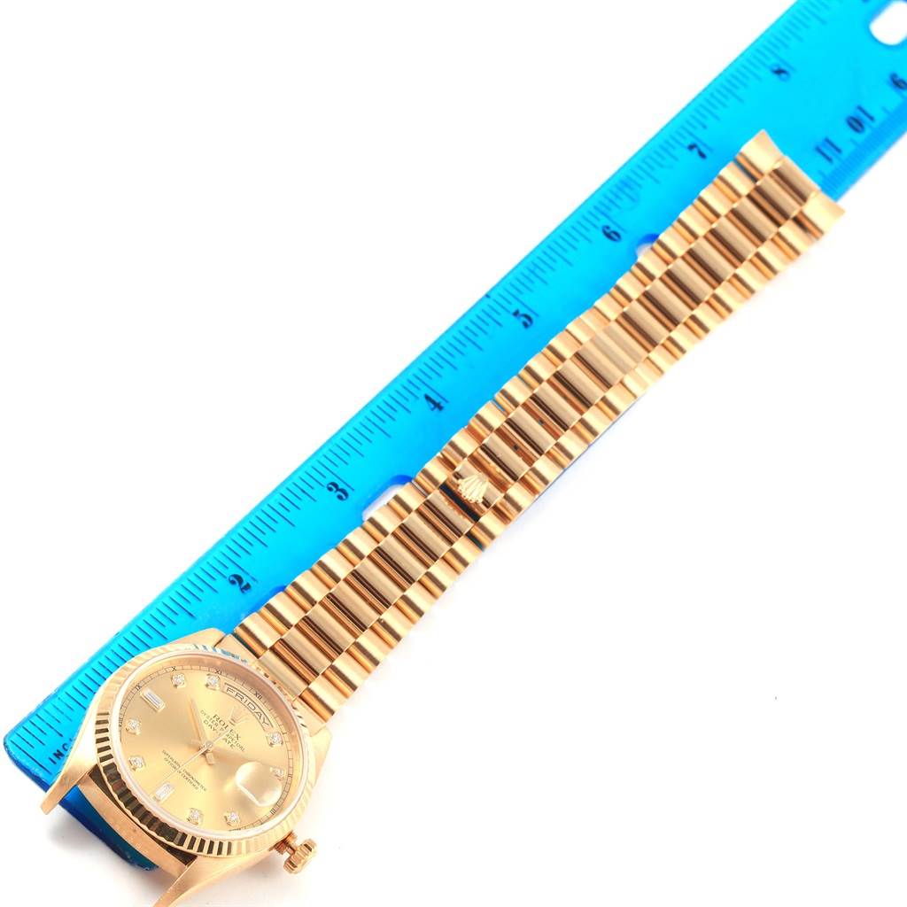 The image shows a Rolex President 18238 Men's Yellow Gold Champagne Dial 18238 Men's Yellow Gold Champagne Dial model watch laid flat with its bracelet and dial adjacent to a ruler for size reference.