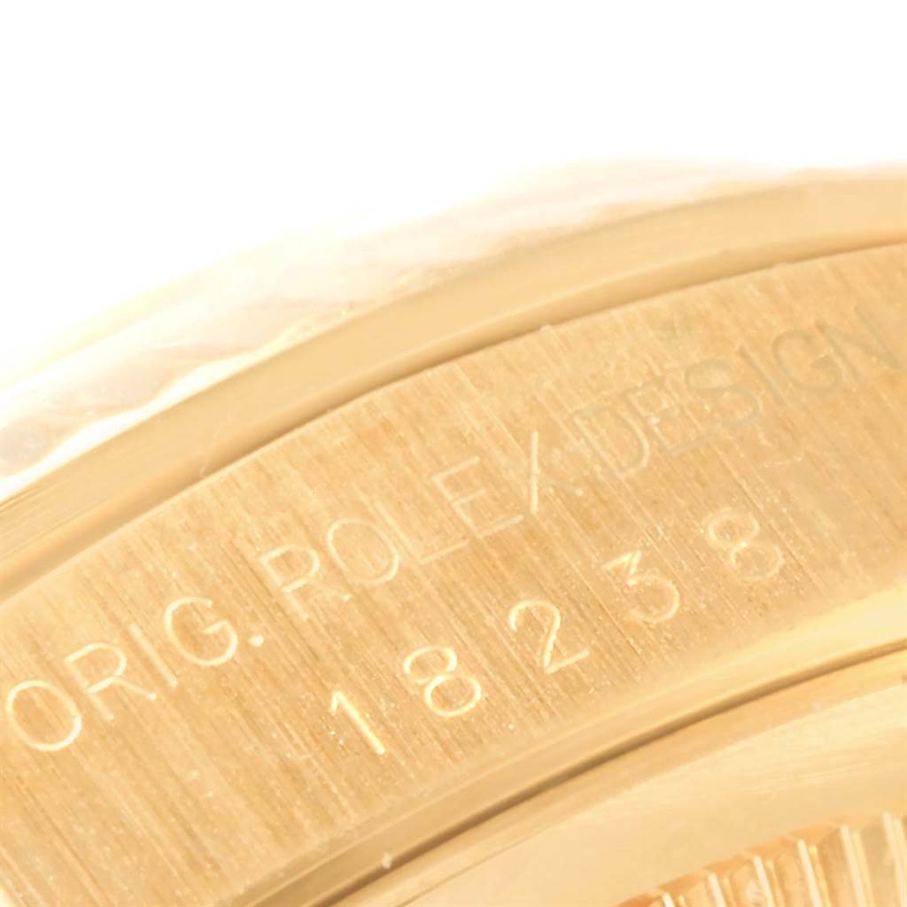 This image shows a close-up angle of the engraved edge on a Rolex President 18238 Men's Yellow Gold Champagne Dial 18238 Men's Yellow Gold Champagne Dial model watch, indicating the design and model number.