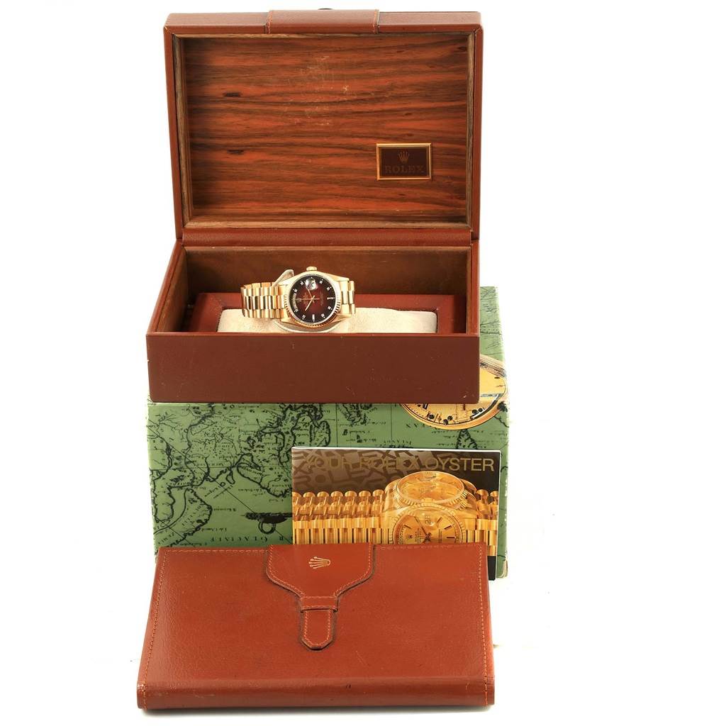 The image shows a Rolex President 18238 Men's Yellow Gold Brown Dial 18238 Men's Yellow Gold Brown Dial watch in an open wooden box, with accompanying accessories and booklets displayed in front.
