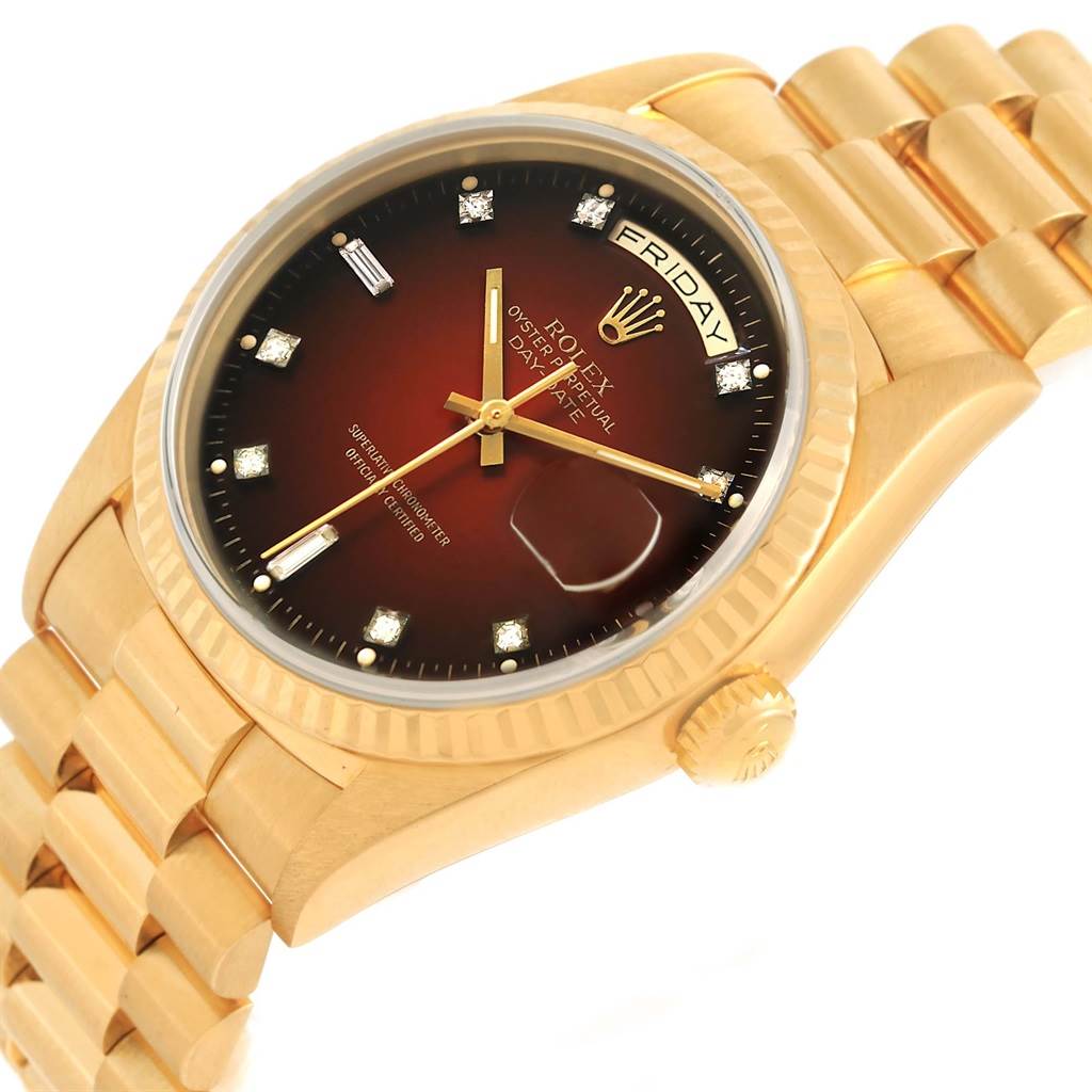 The Rolex President 18238 Men's Yellow Gold Brown Dial 18238 Men's Yellow Gold Brown Dial model watch is shown at an angled view, displaying the gold bracelet, crown, and brown dial with diamond hour markers.