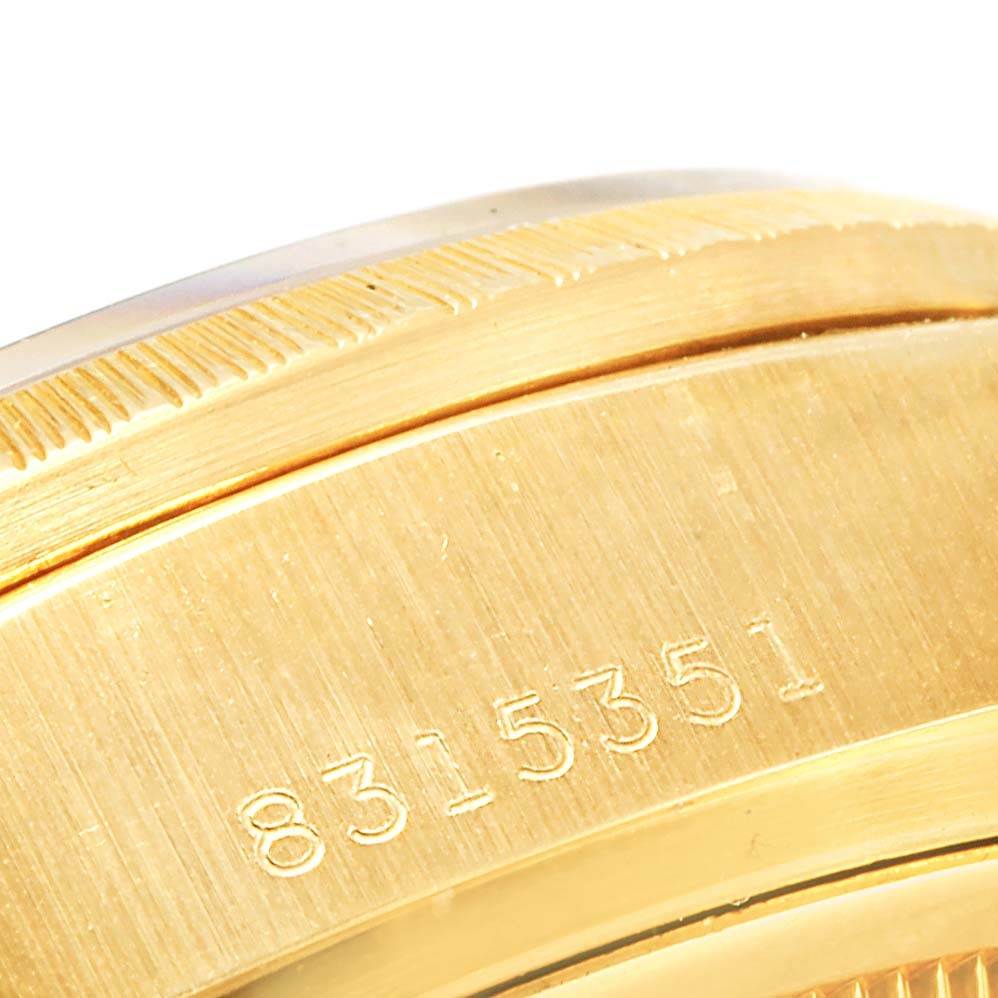 The image shows a close-up of the side view of a Rolex President 18078 Men's Yellow Gold Brown Dial 18078 Men's Yellow Gold Brown Dial model watch, highlighting the engraved serial number.