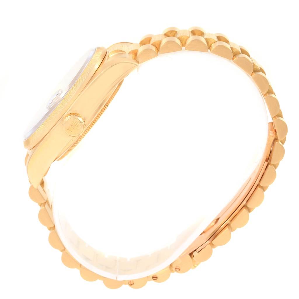 The image shows a side profile of the Rolex President 18078 Men's Yellow Gold Brown Dial 18078 Men's Yellow Gold Brown Dial watch, featuring its gold case, crown, and bracelet.